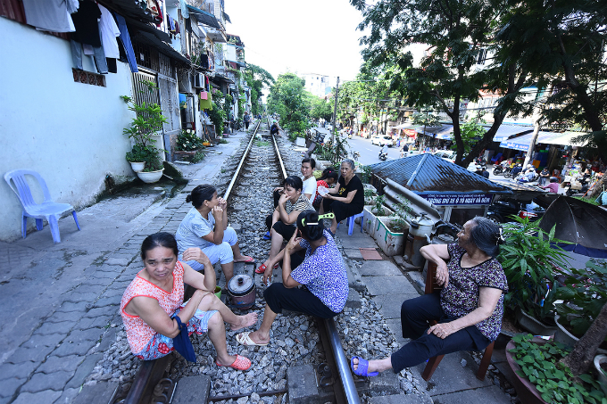 Locals seating on railway in Hanoi