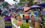 Locals selling homegrown fruits and vegetables at Bac Ha Market