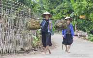 Ethnic woman are happily walking on village road