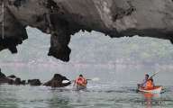 Kayaking through the rocks on Halong bay