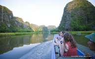 Foreign tourists enjoying the boat trip in Tam Coc