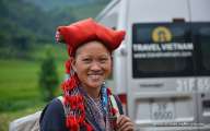 A woman in Sapa in front of Travel Vietnam car