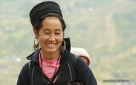 Young mother with her child on back – a very popular image in Sapa